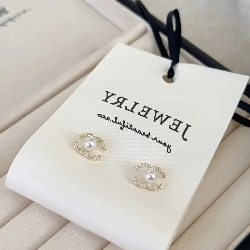 CC pearl diamond earrings